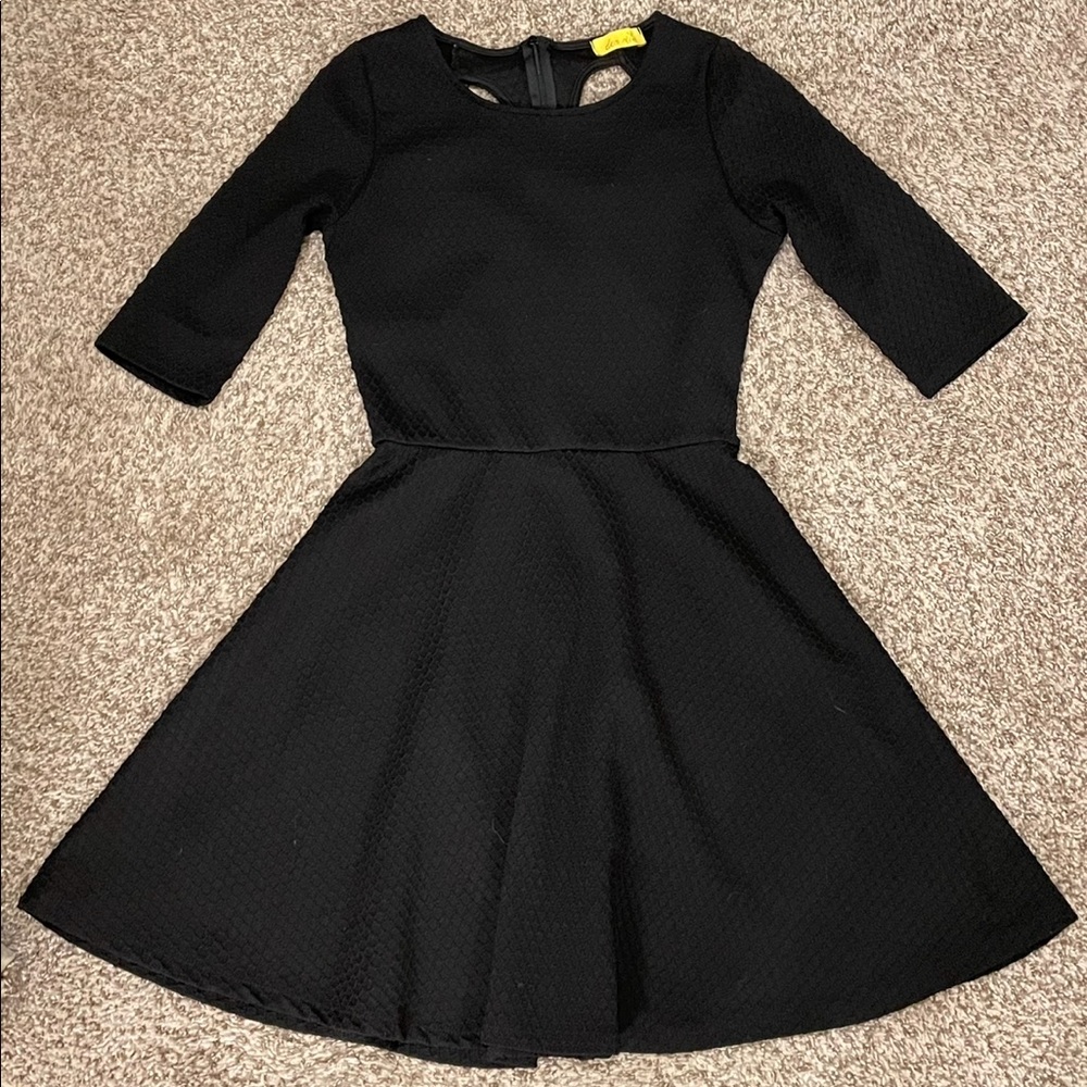 Structured black cocktail dress with keyhole back detail